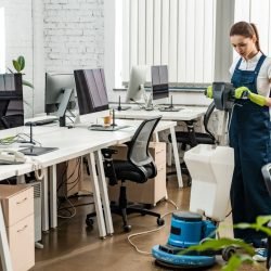 young-cleaner-washing-floor-in-open-space-office young-cleaner-washing-floor-in-open-space-office